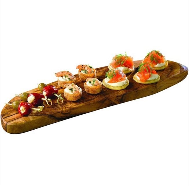 Canapés on wooden serving board